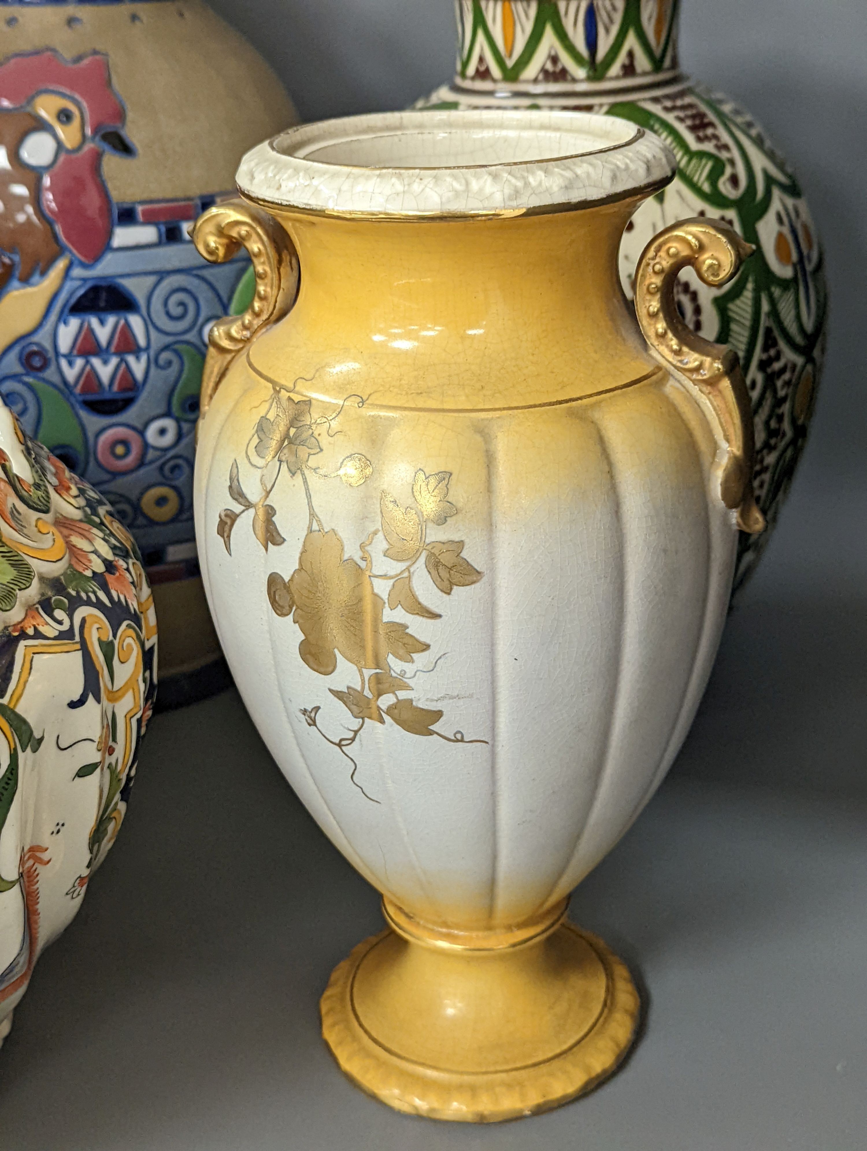 A Mont Saint Michael jardiniere, a lidded jar, two vases and an Amphora chicken decorated vase, Amphora vase 36 cms high.